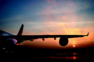 Air flight sunset